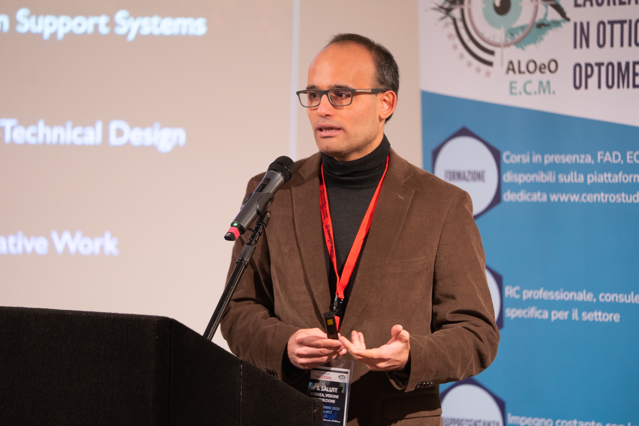 Luca Marconi speaking at a scientific conference in 2025